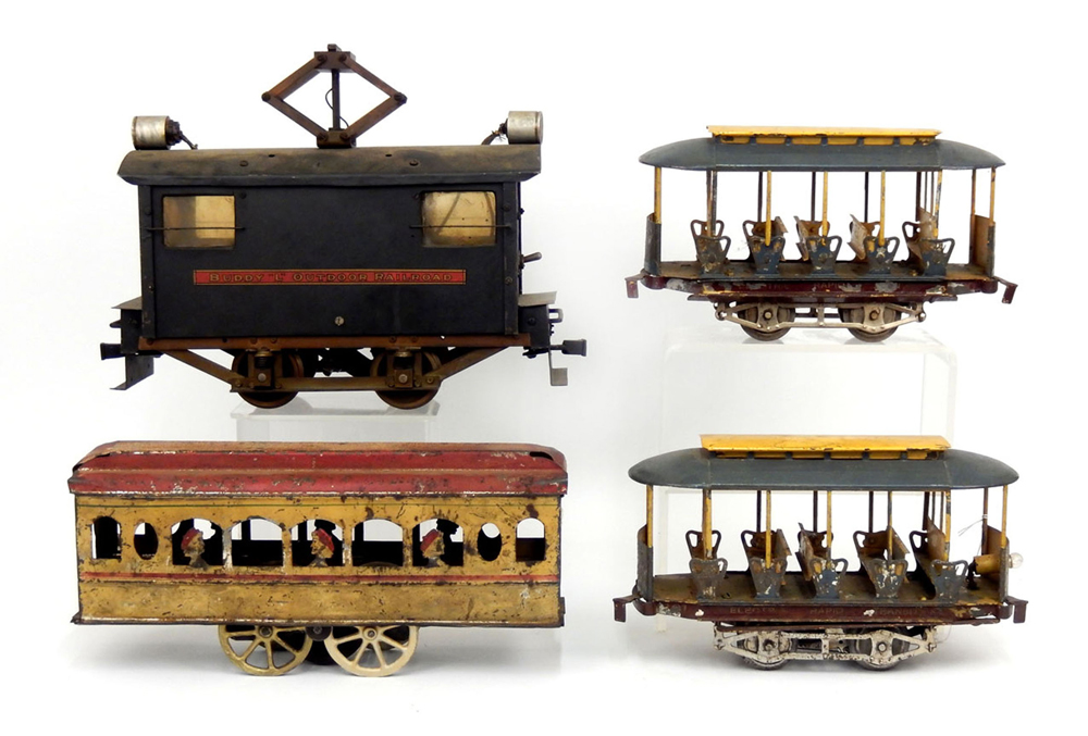 (Clockwise from upper left) Buddy ‘L’ Outdoor Railroad, Lionel Electric Rapid Transit trolley, a second example of the same Lionel trolley, and a yellow with red roof tin trolley. Stephenson’s Auctioneers image
